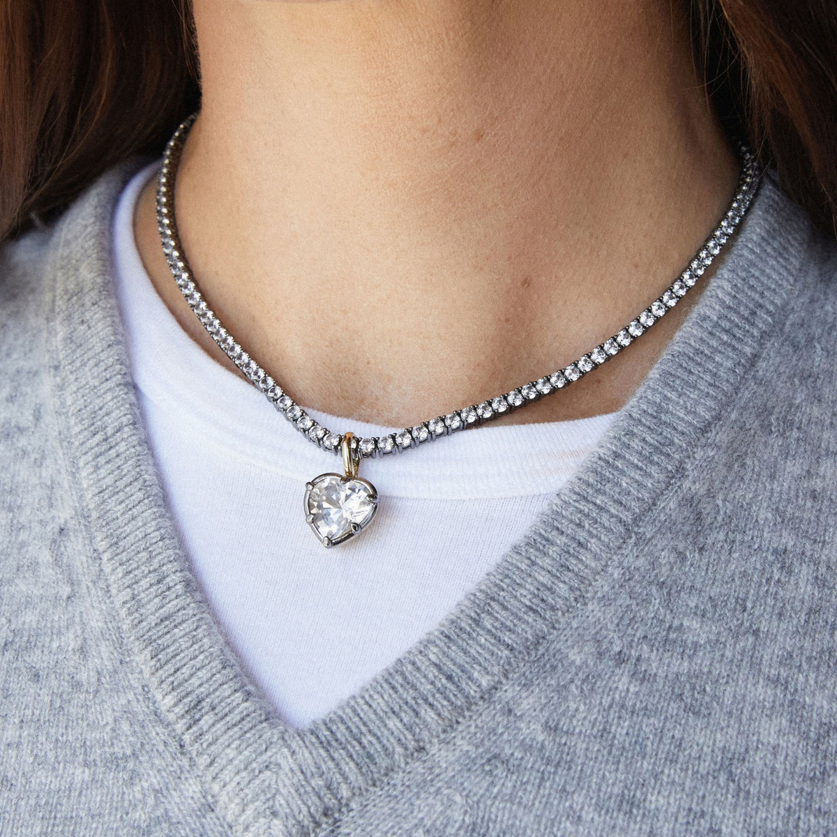 Model. Close up of woman wearing a Heart Georgian Pendant on a tennis necklace