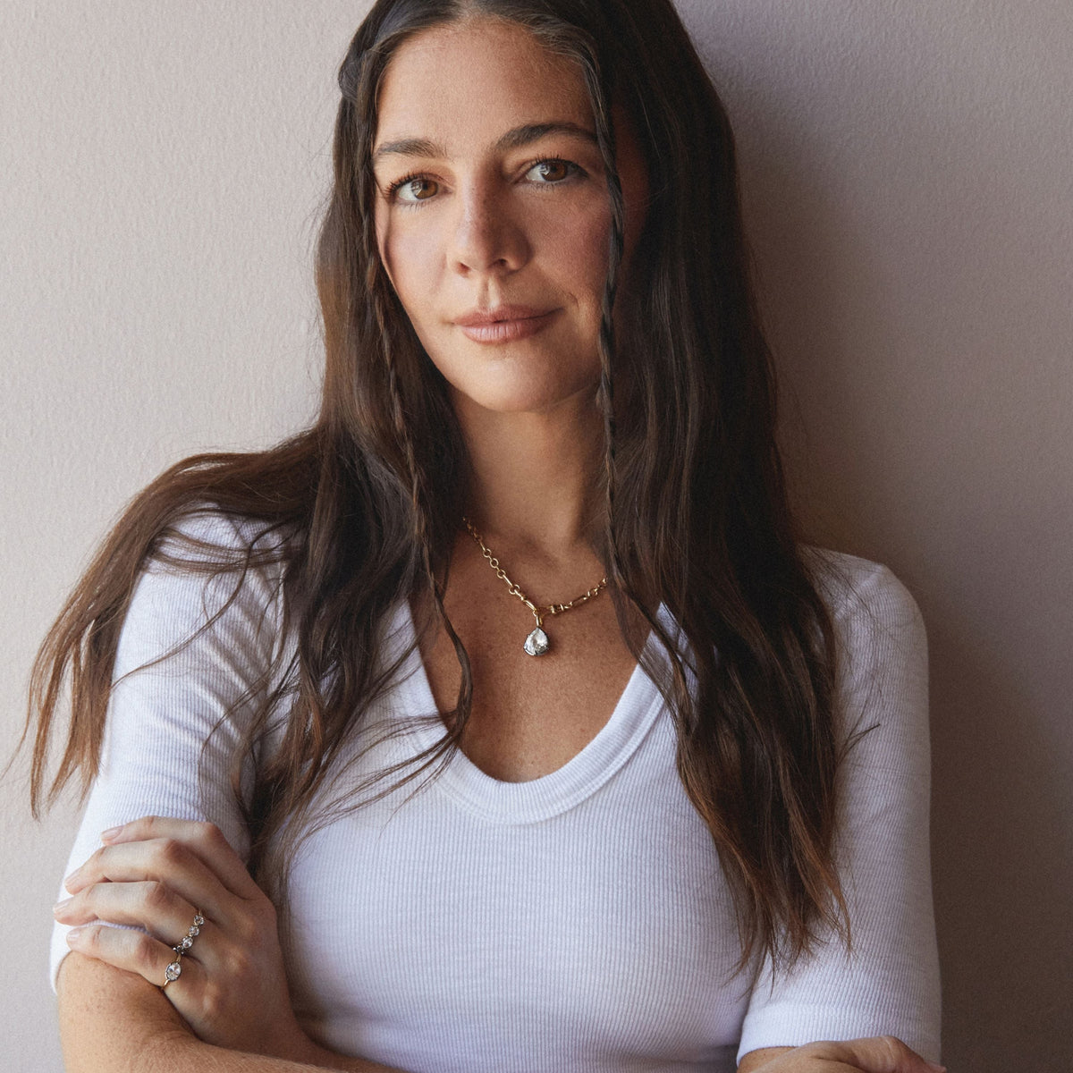 Model. A woman wearing a chain necklace with a Pear Georgian Pendant. 