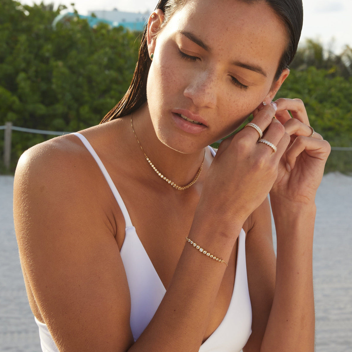 Lifestyle Model woman wearing various rings and bracelet 