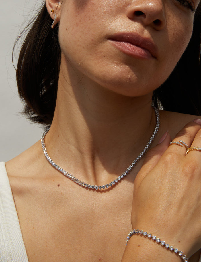 Model.  woman wearing diamond rings and necklace 
