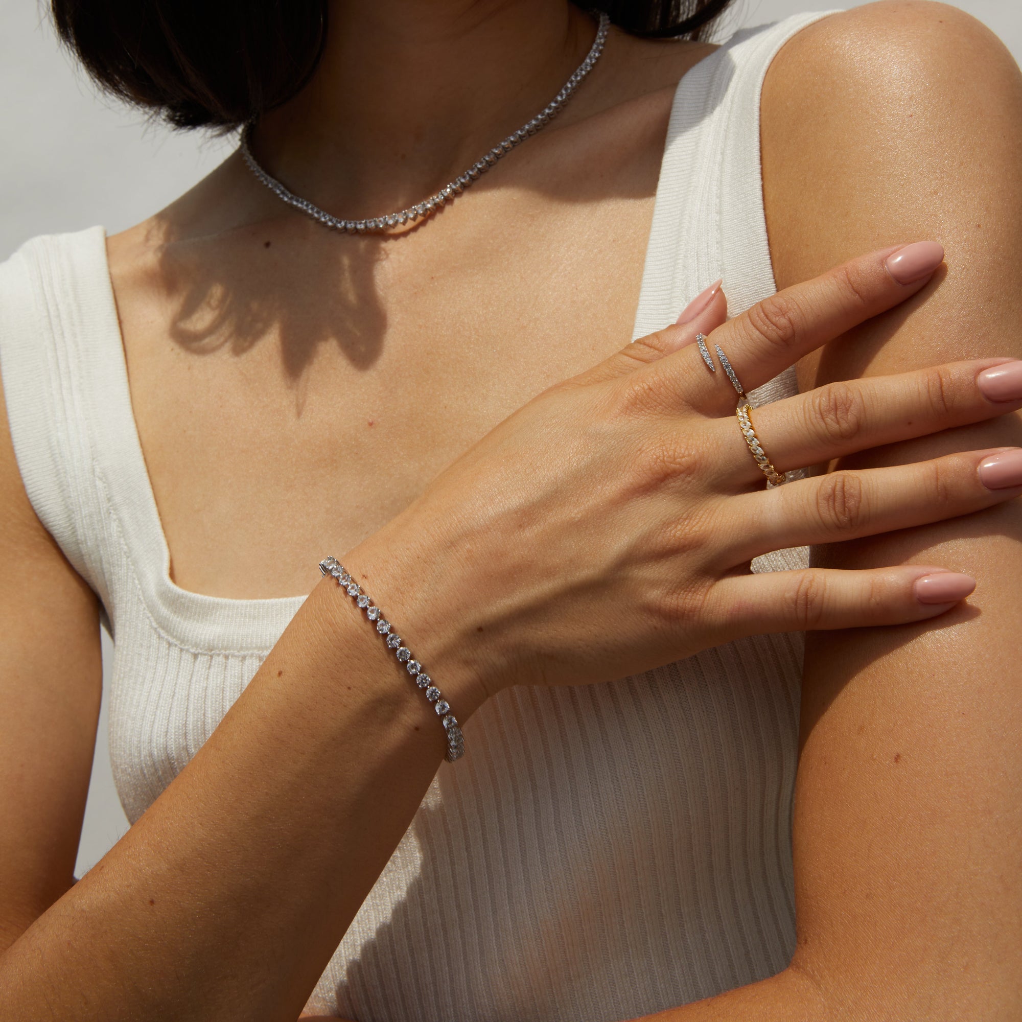 Model.  Woman wearing diamond bracelet and rings 