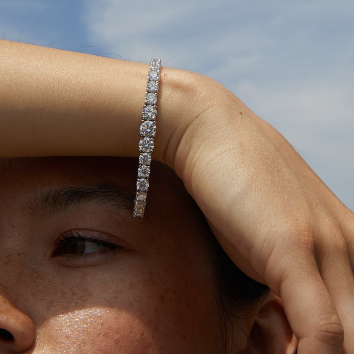 Model.  Woman wearing large diamond bracelet 