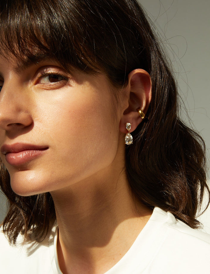 Lifestyle Model side profile of woman wearing diamond teardrop earring 