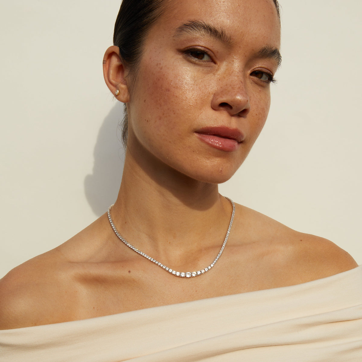Model.  Woman wearing diamond necklace 