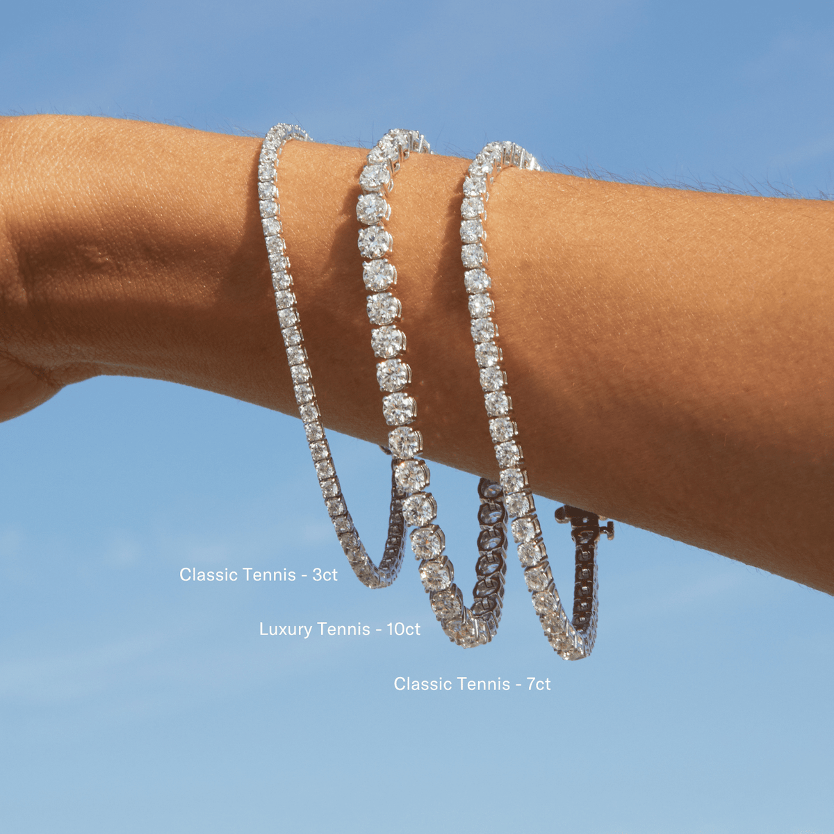 Lifestyle Model close up of woman wearing three diamond tennis bracelets 