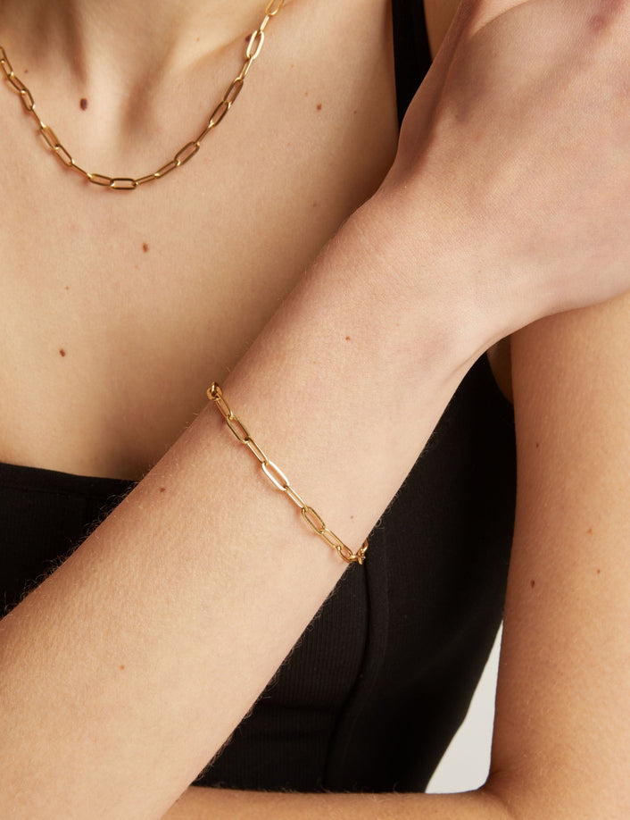 Gold chain bracelet on a person