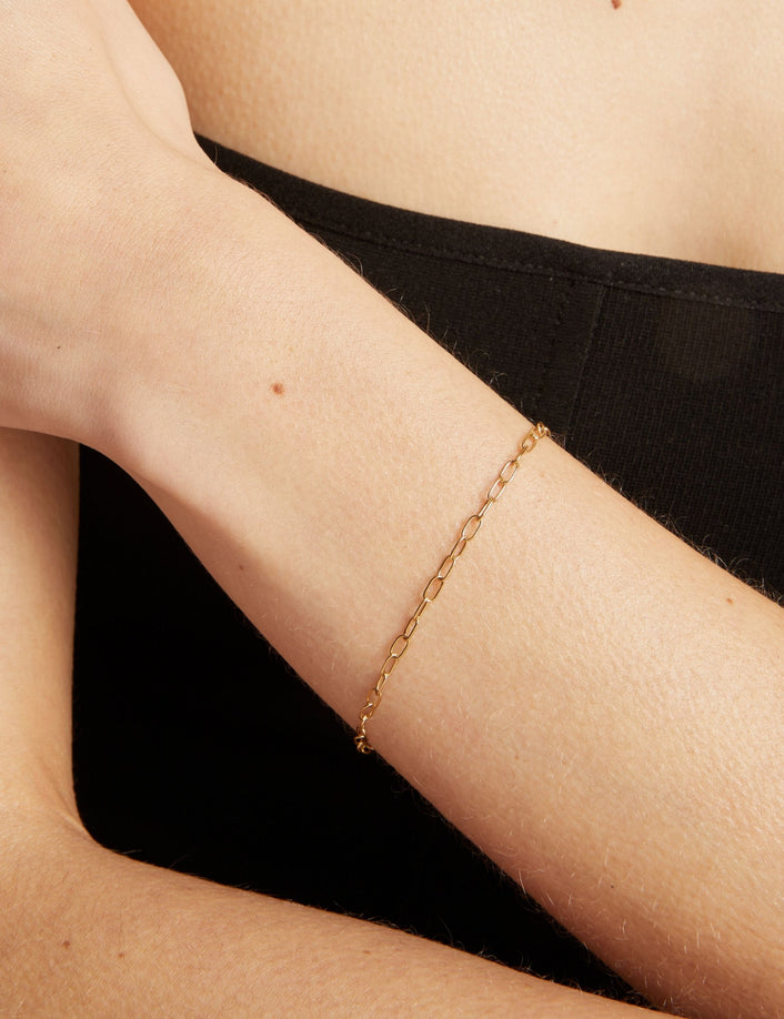Gold bracelet on a person