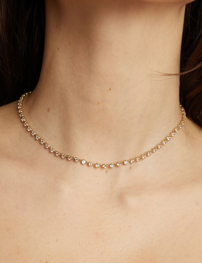 Gold necklace on a person