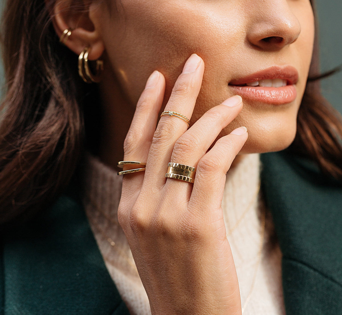 Lifestyle Model. Close up of woman's hand wearing various rings