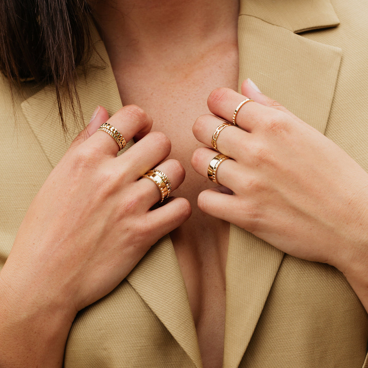 Model. Close up of woman's hands wearing various rings