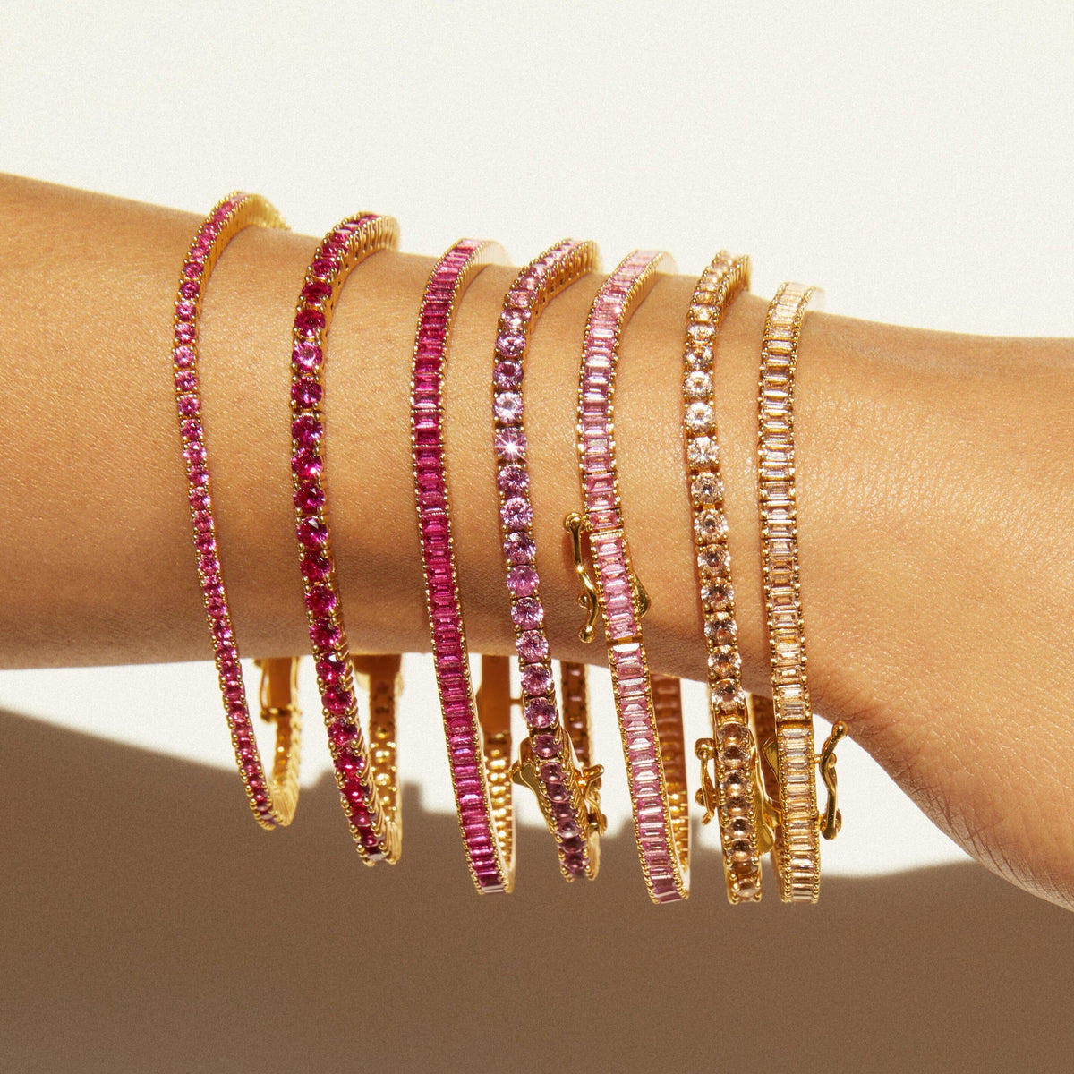 Lifestyle Model close up of different color tennis bracelets on a wrist 