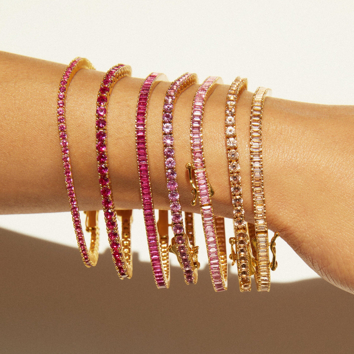 Lifestyle Model different colored tennis bracelets on a wrist 