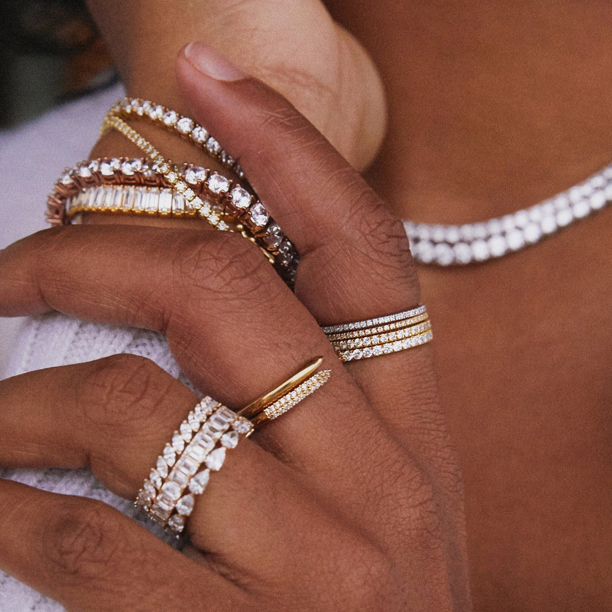 Lifestyle Model close up of various diamond jewelry 