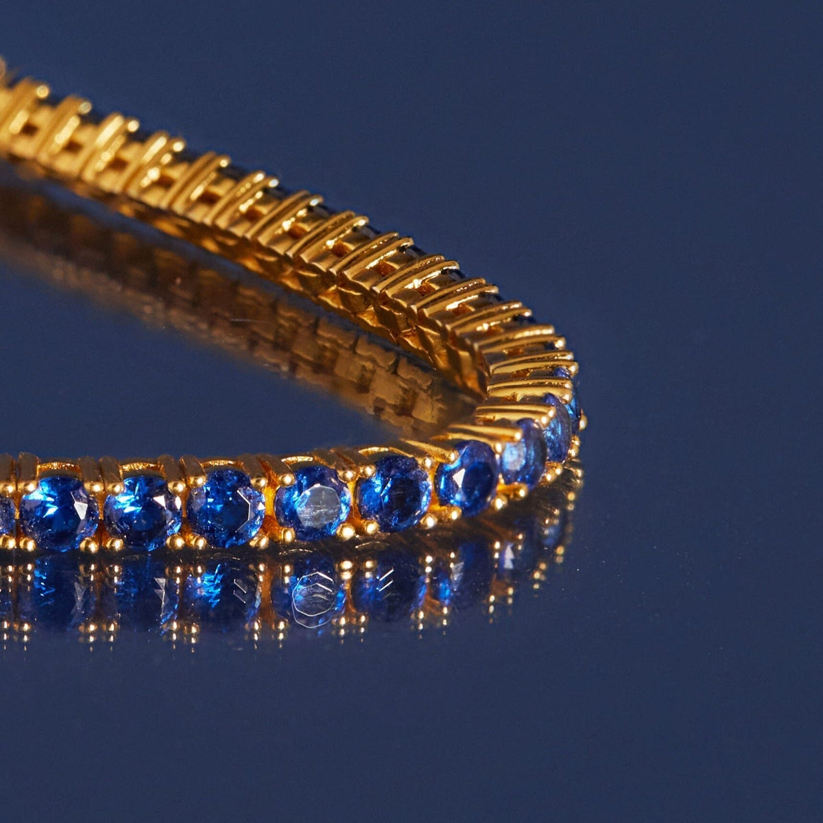 Flatlay Model blue stone necklace on a blue background 