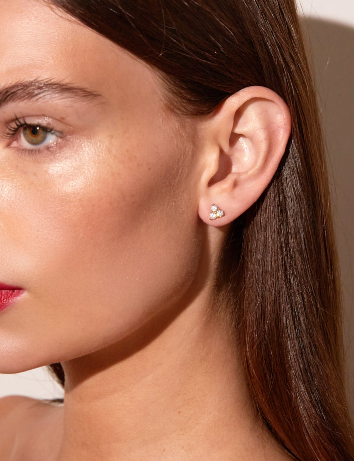 Model.  woman wear triangle earring 