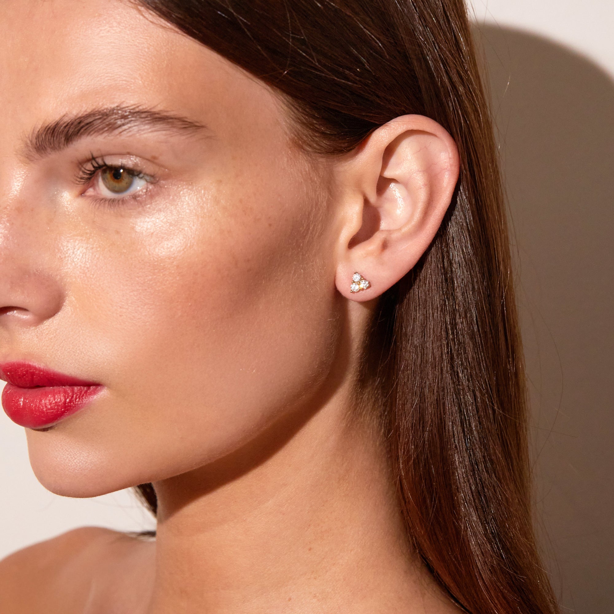 Model.  woman wear triangle earring 