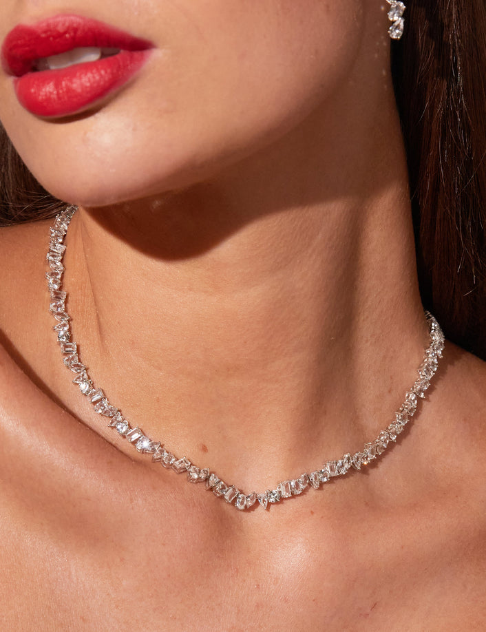 Close up of woman wearing tennis necklace with unique shape