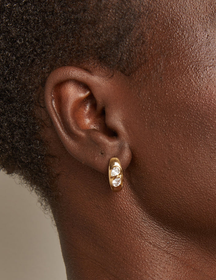 Woman wearing gold earring 
