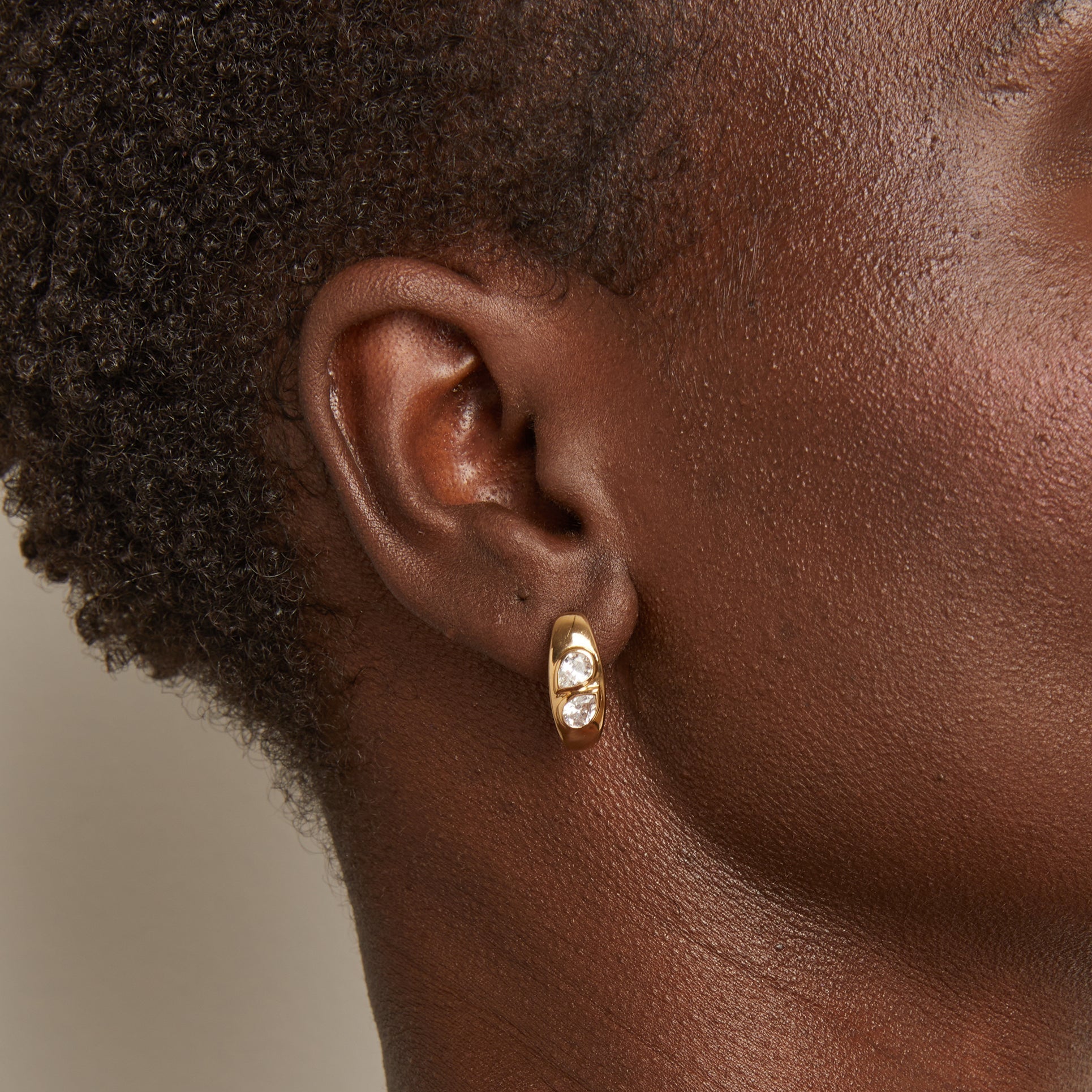 Woman wearing gold earring 