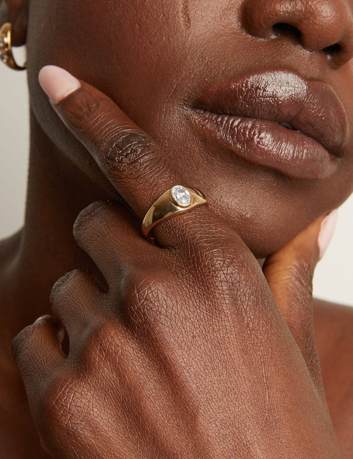 Woman wearing gold chunky ring