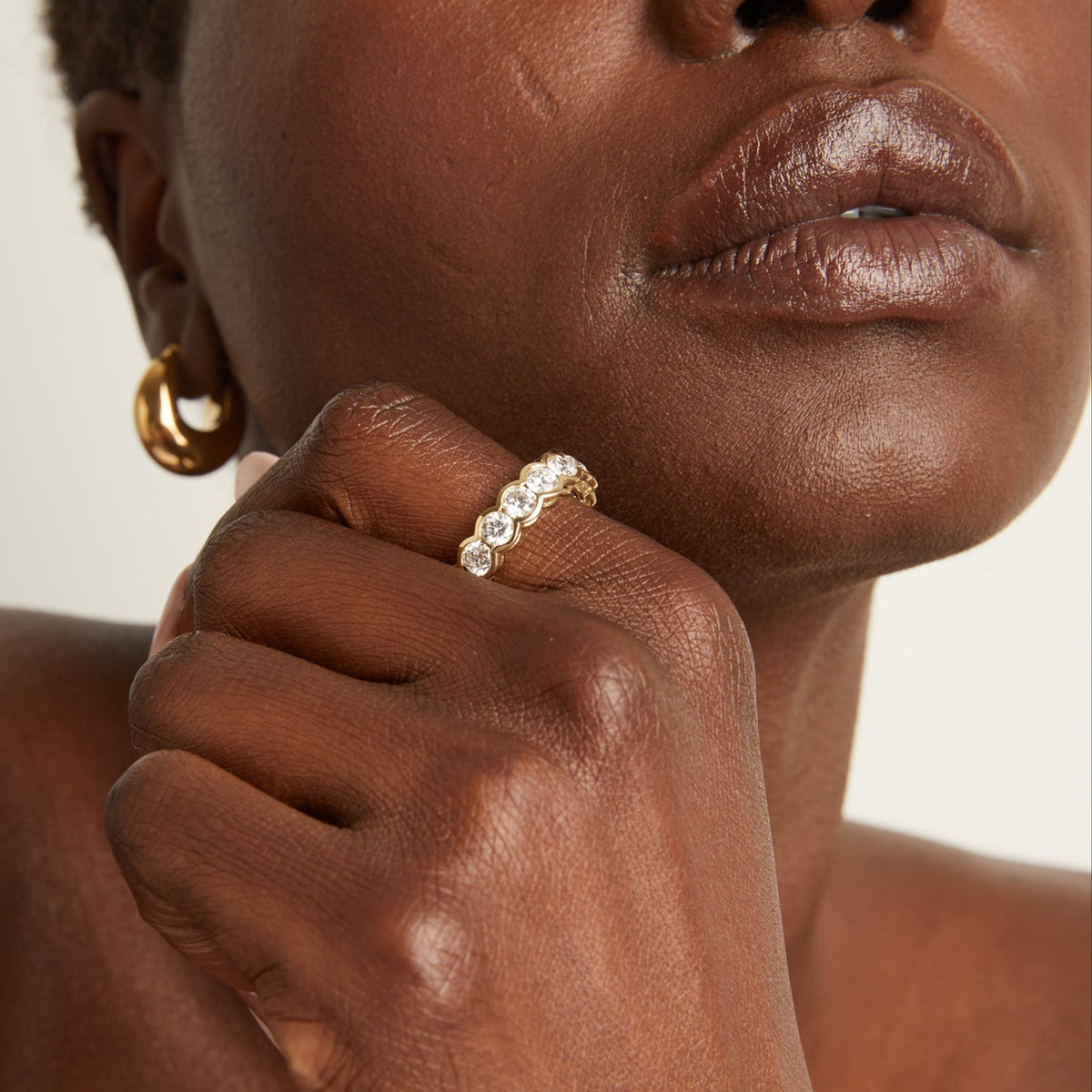 Model. Close up of woman wearing diamond ring 
