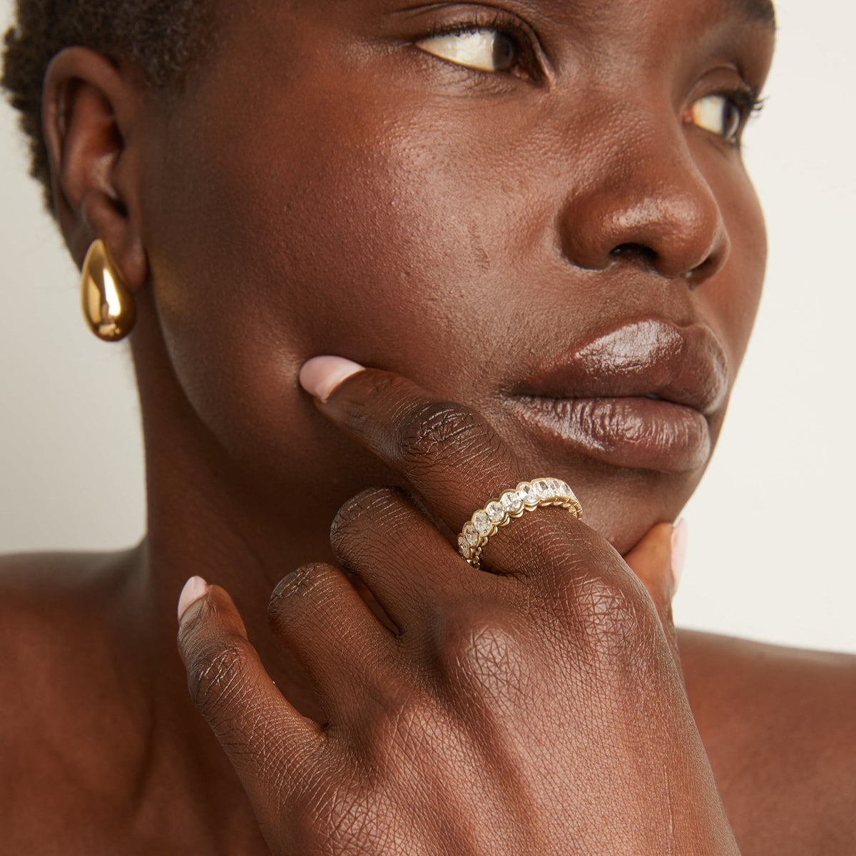 Model close up of woman wearing diamond ring 