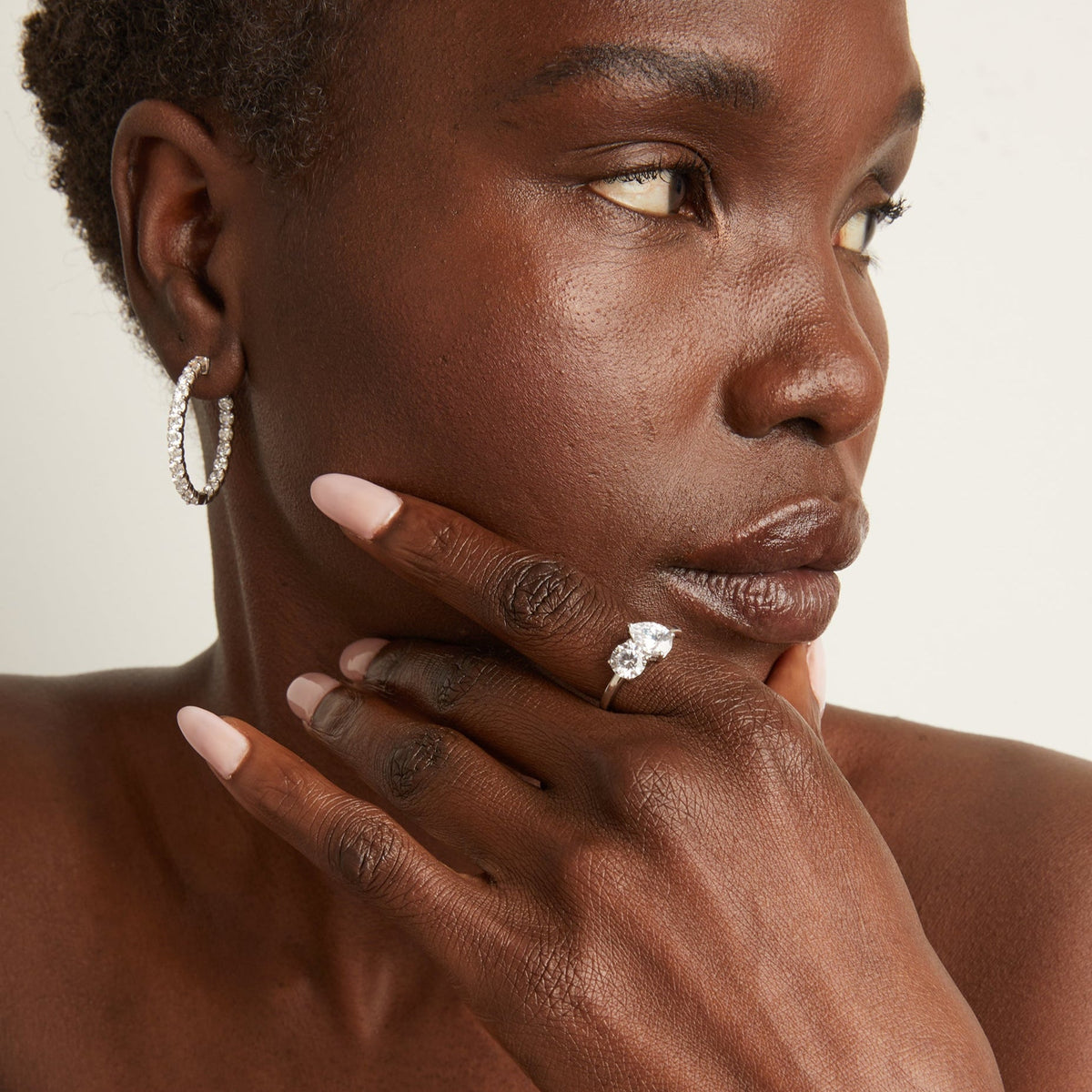 Model. Woman wearing a diamond ring 