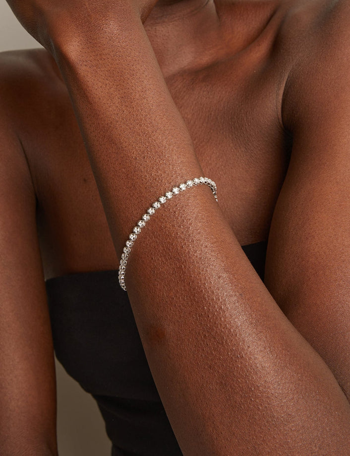 Silver bracelet on a person