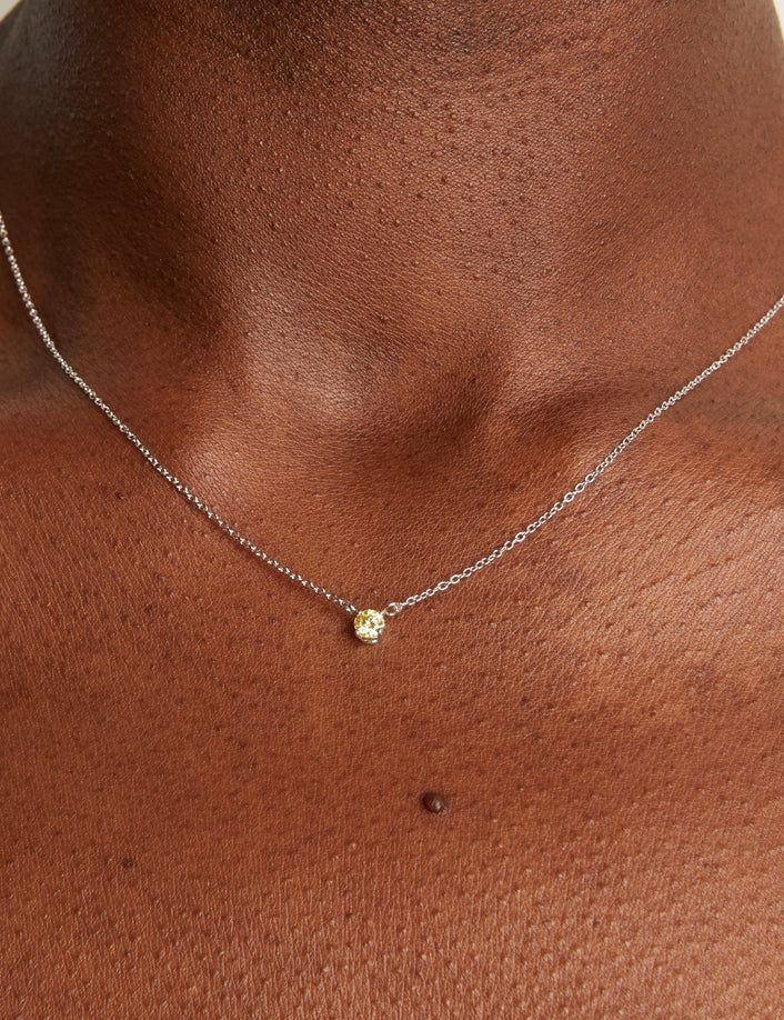 Model. Woman wearing delicate chain necklace. 