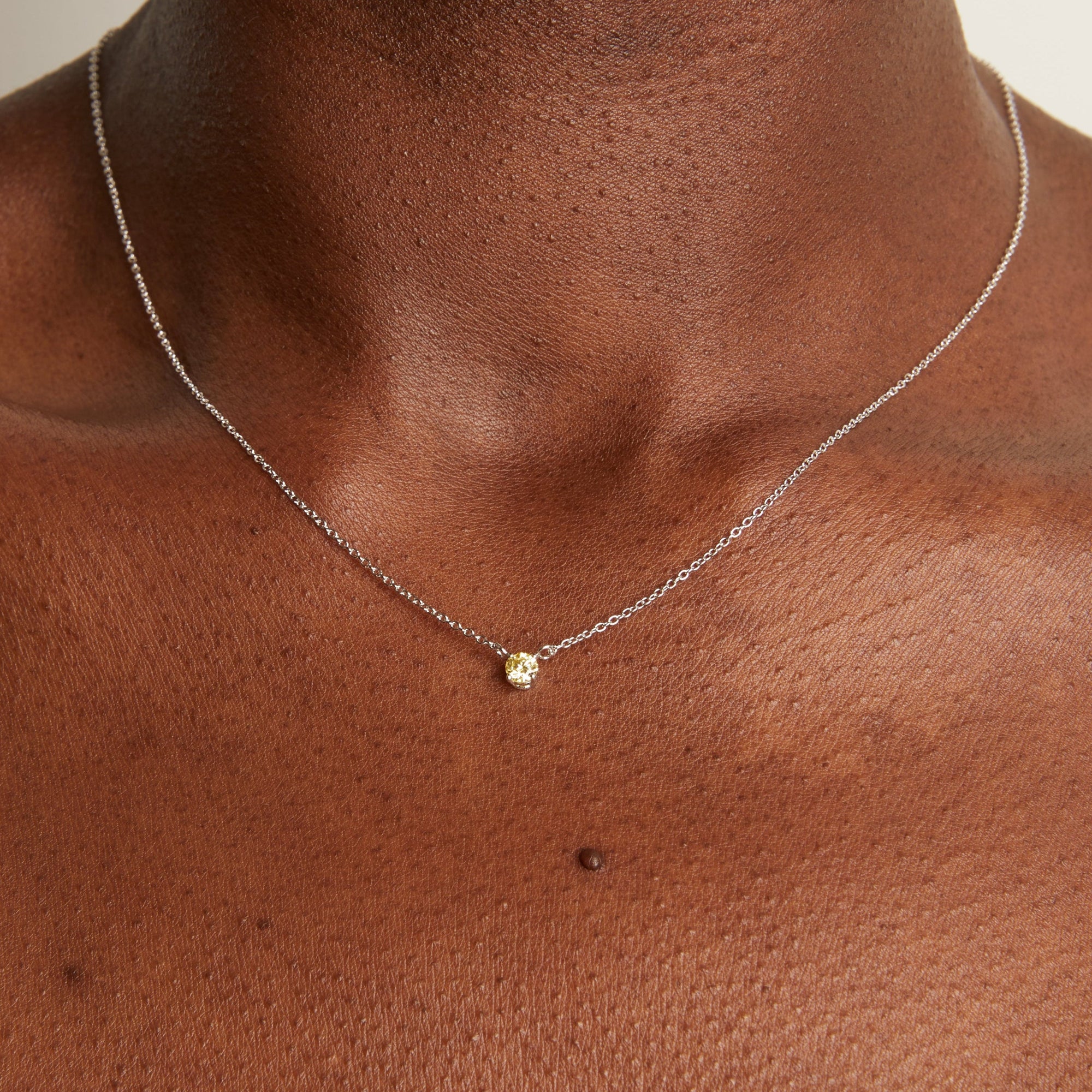 Model. Woman wearing delicate chain necklace. 