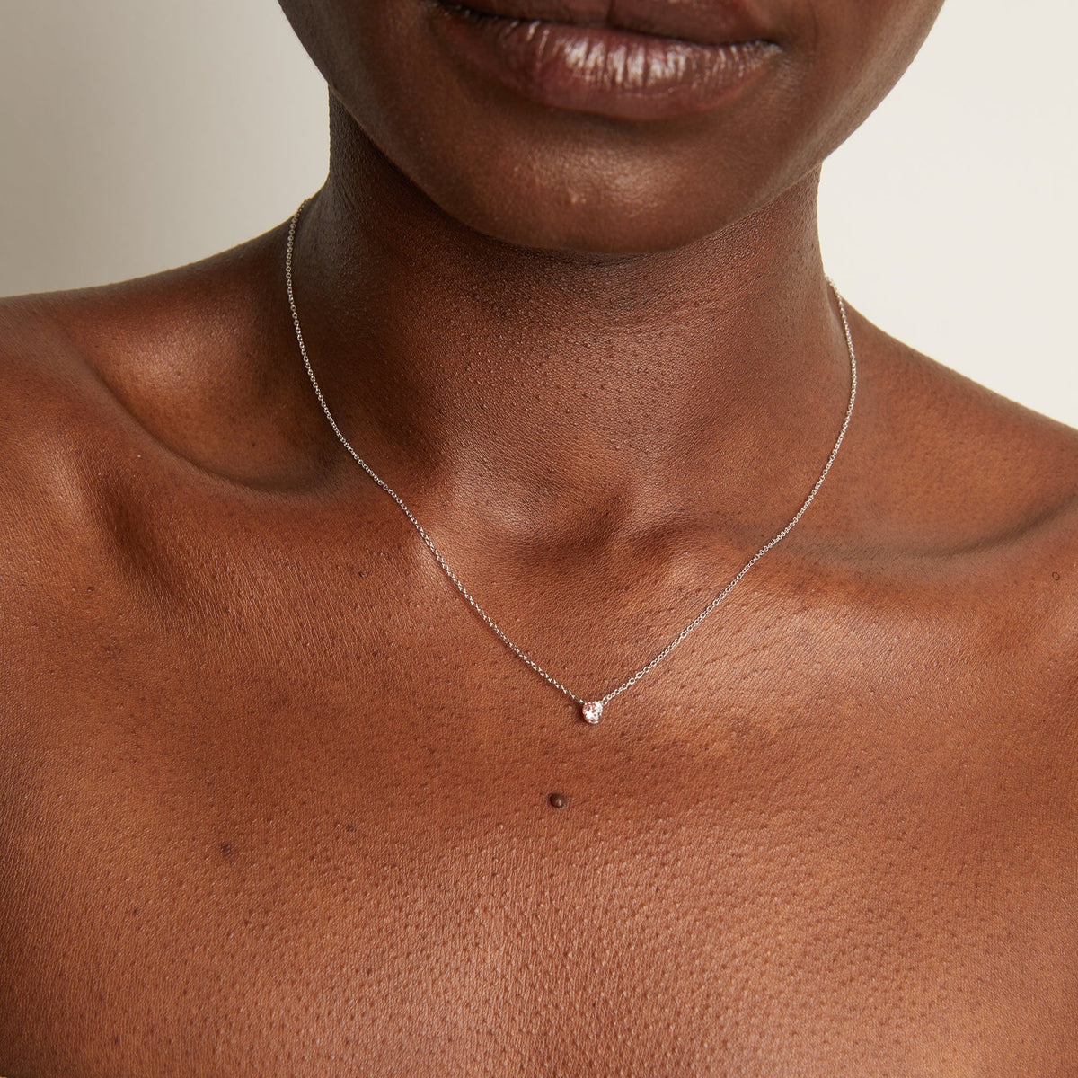Model. Woman wearing delicate chain necklace