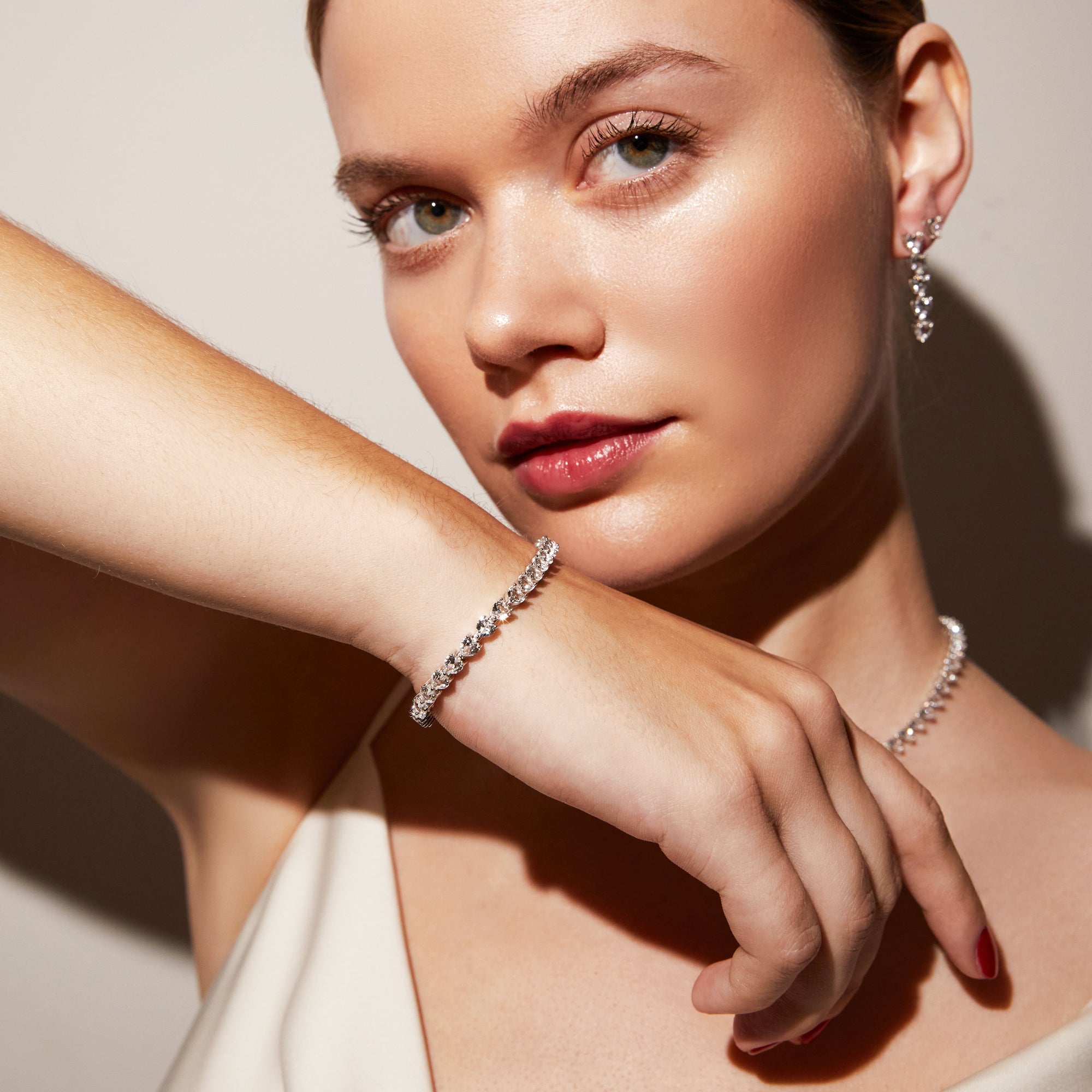 Model.  close up of woman wearing stone bracelet 