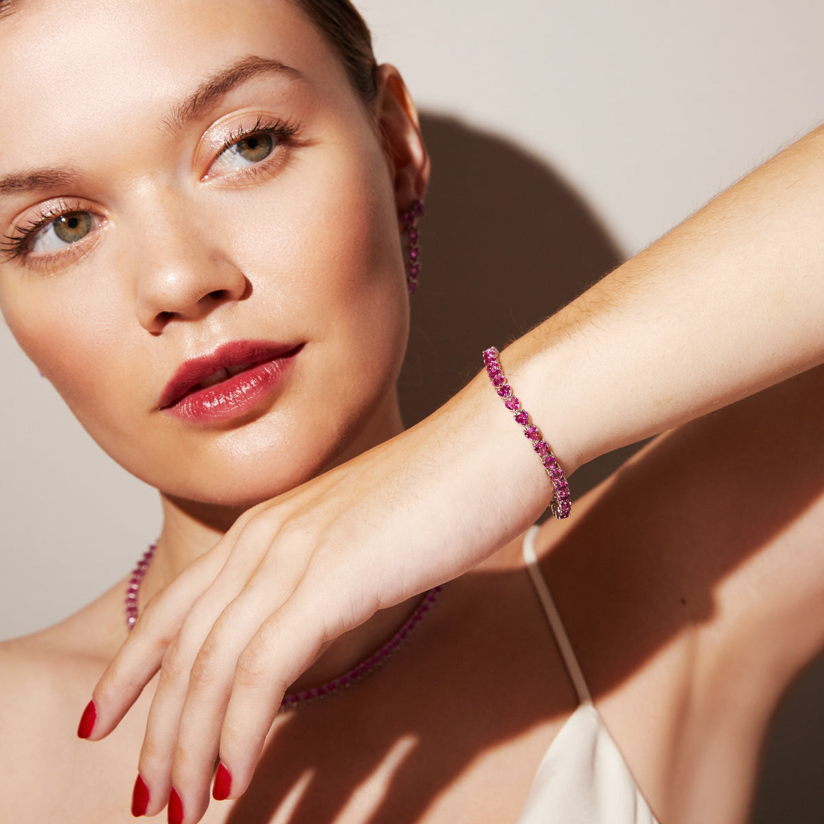 Model.  woman wearing pink stone bracelet 
