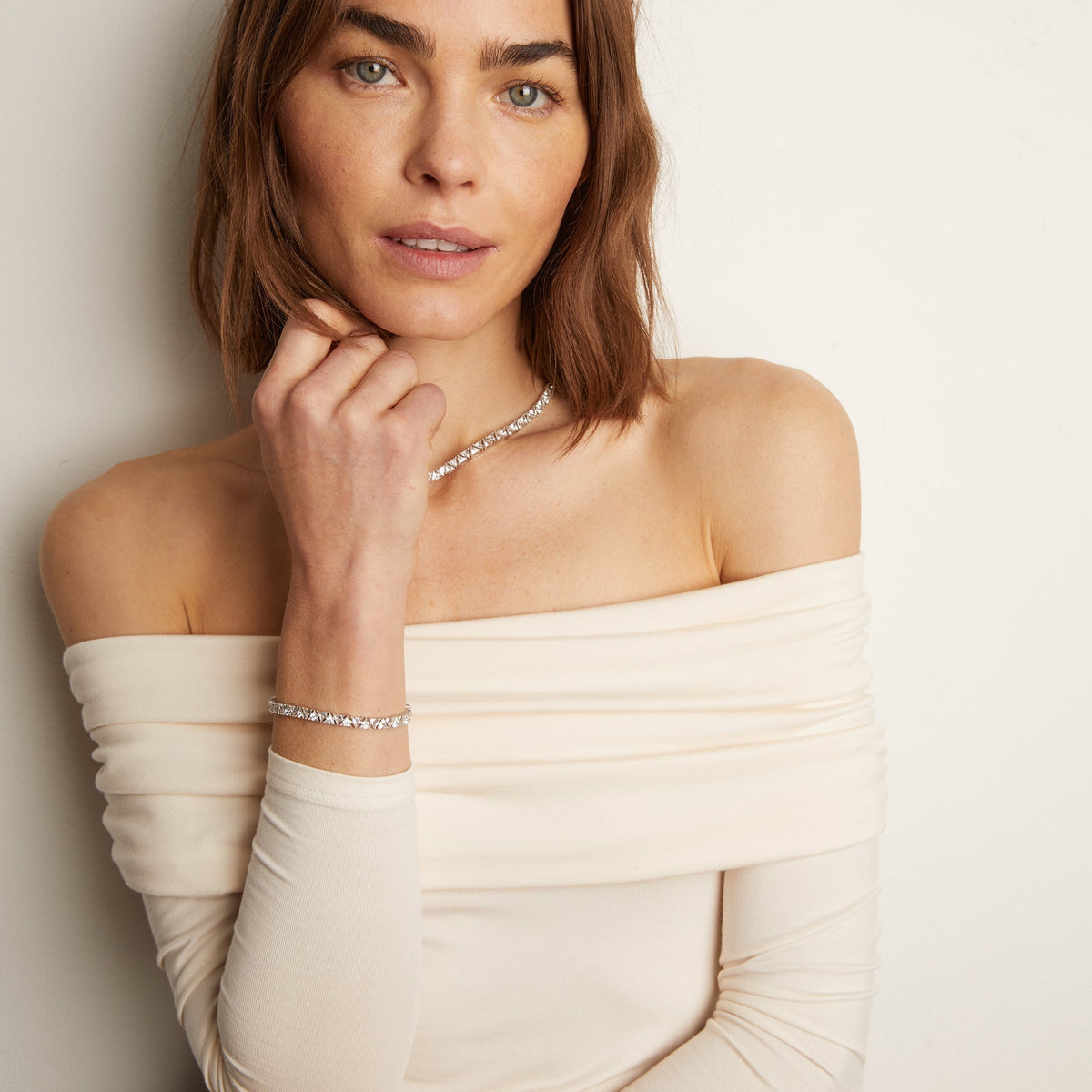Model.  woman wearing diamond necklace and bracelet 