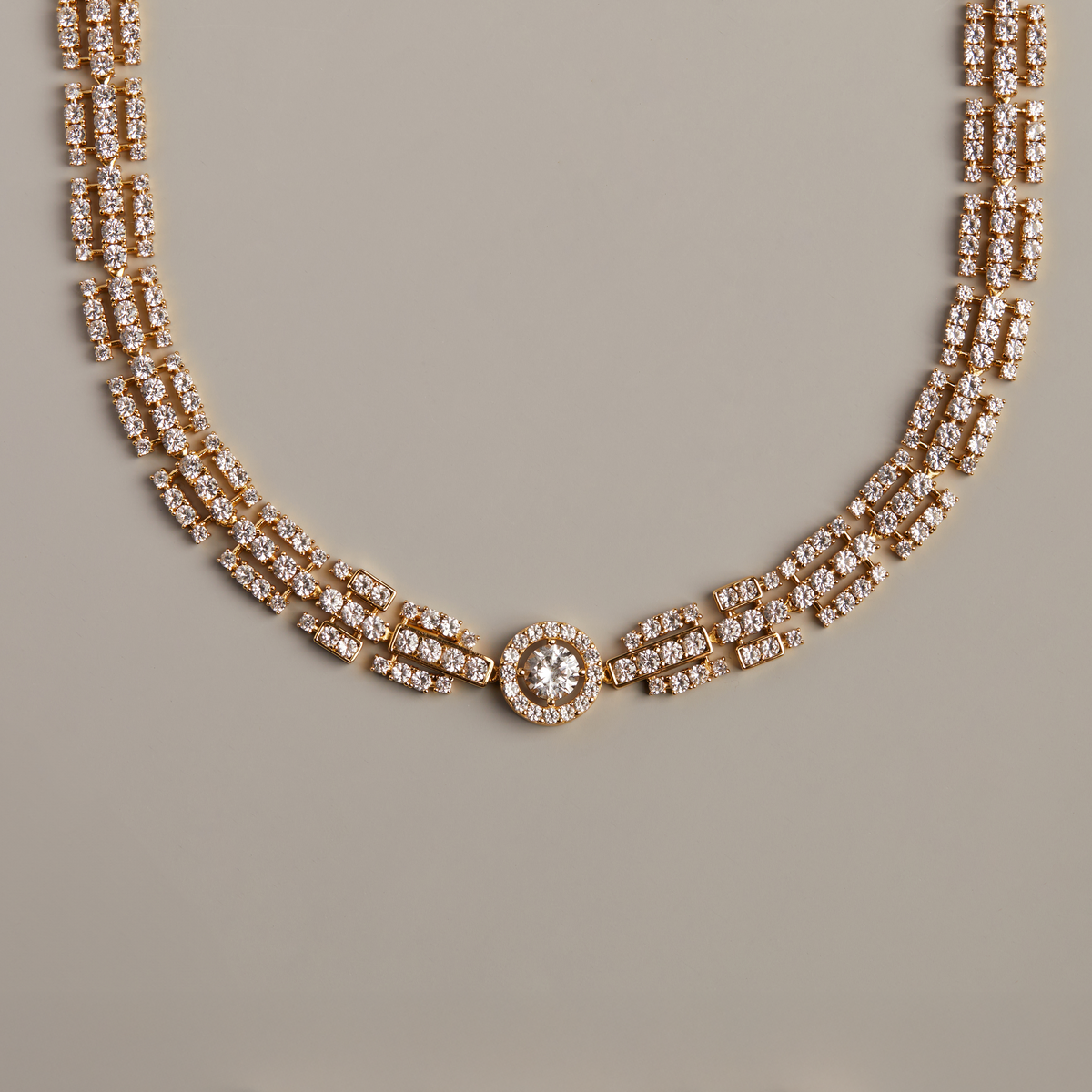 Model. Elegant diamond necklace on a beige background with the word 'EXPLANATION' spelled out below.