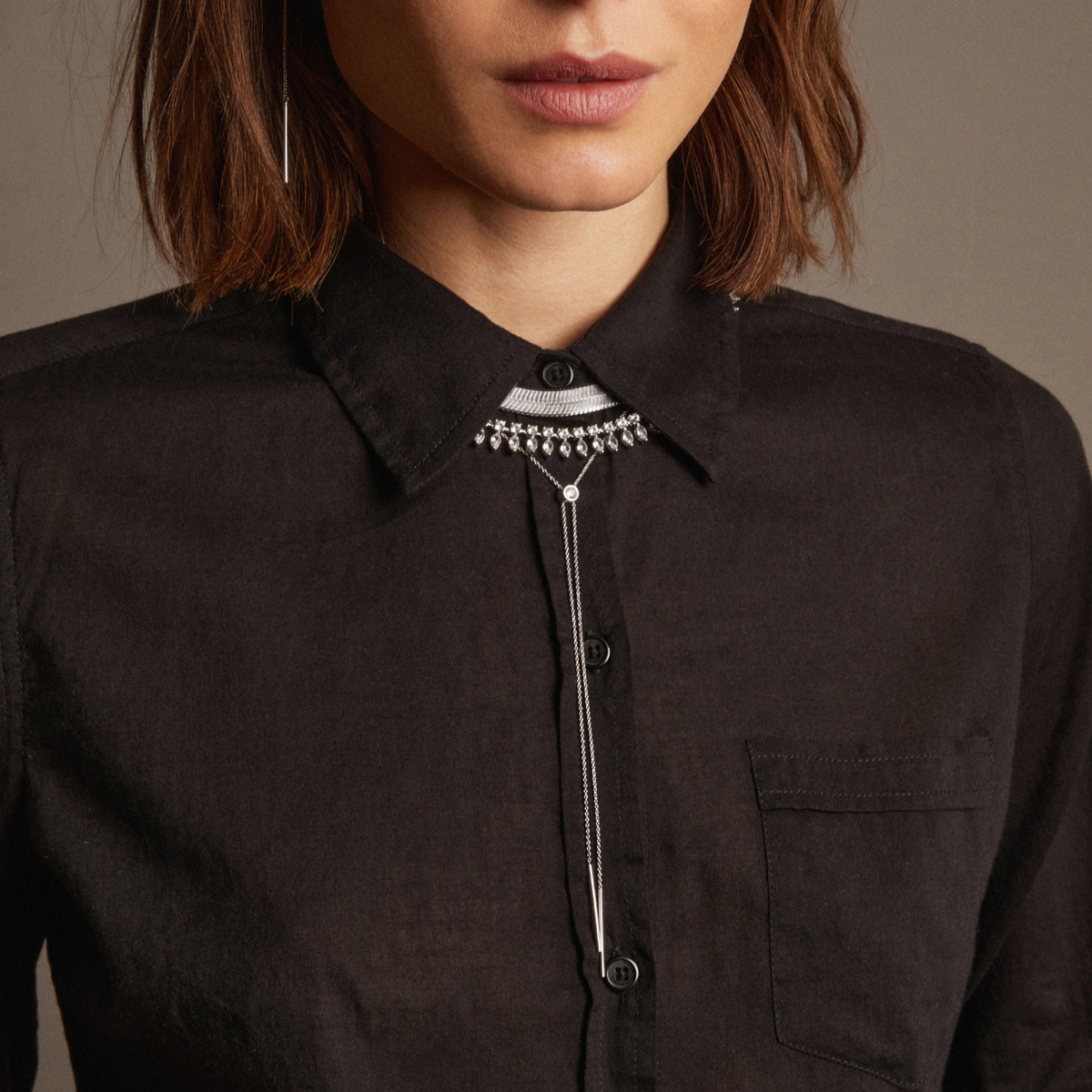 Model. Woman wearing silver bolo necklace