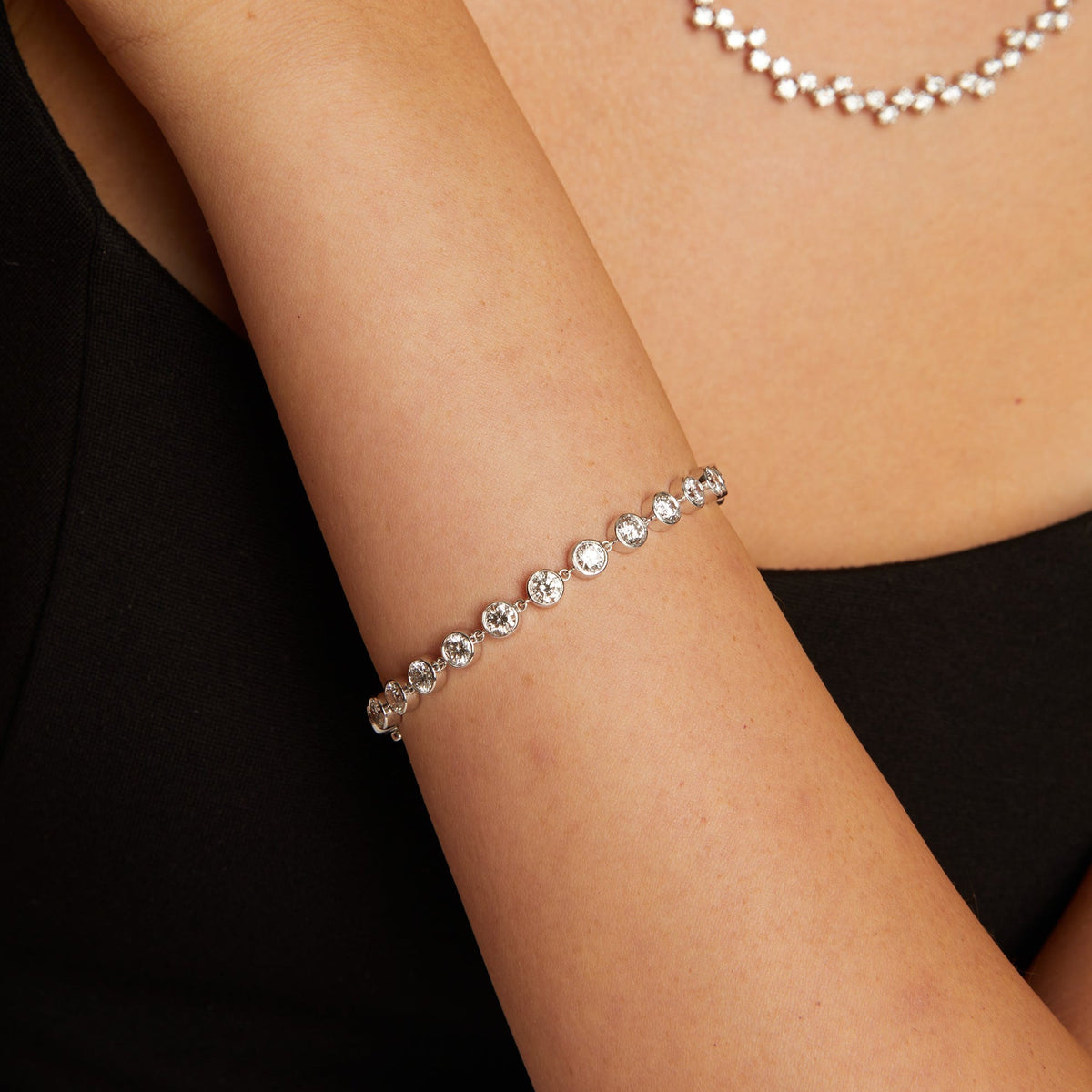 Model. Silver bracelet on a person's wrist with a blurred background