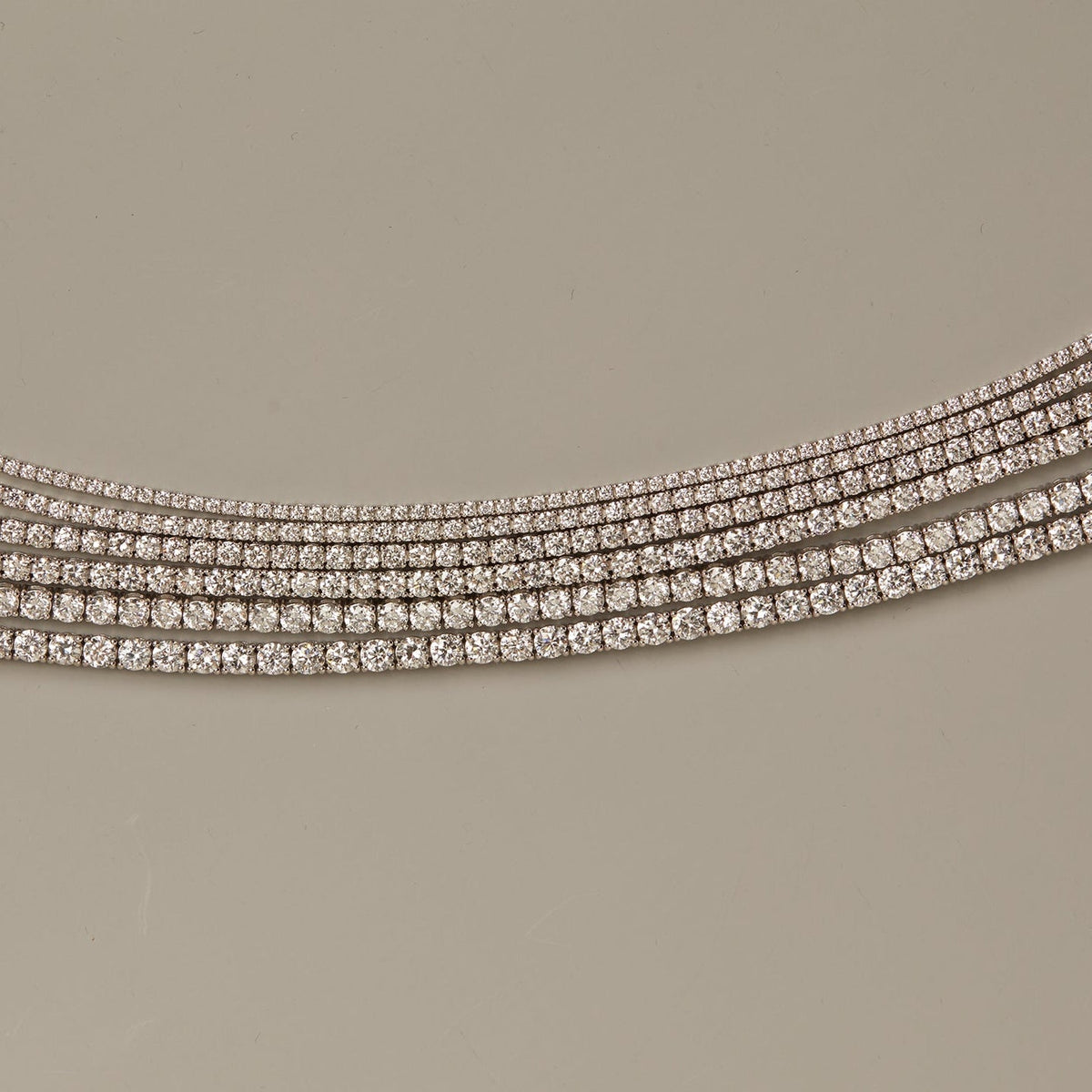 Model. Diamond-studded equestrian bridle on a beige background