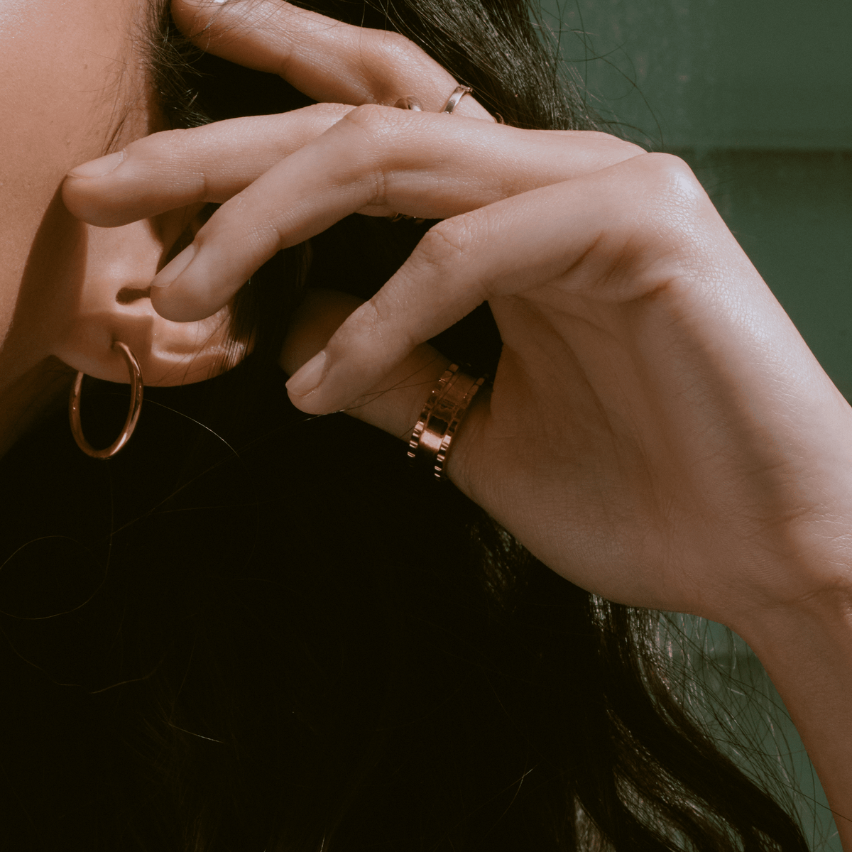 Lifestyle Model. Close up of woman's hand wearing various rings