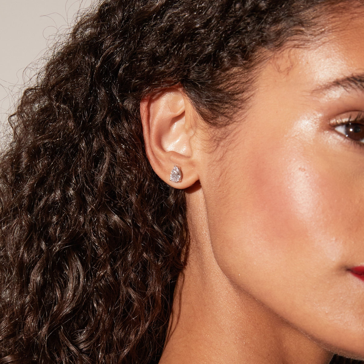 Model. close up of woman wearing diamond earring