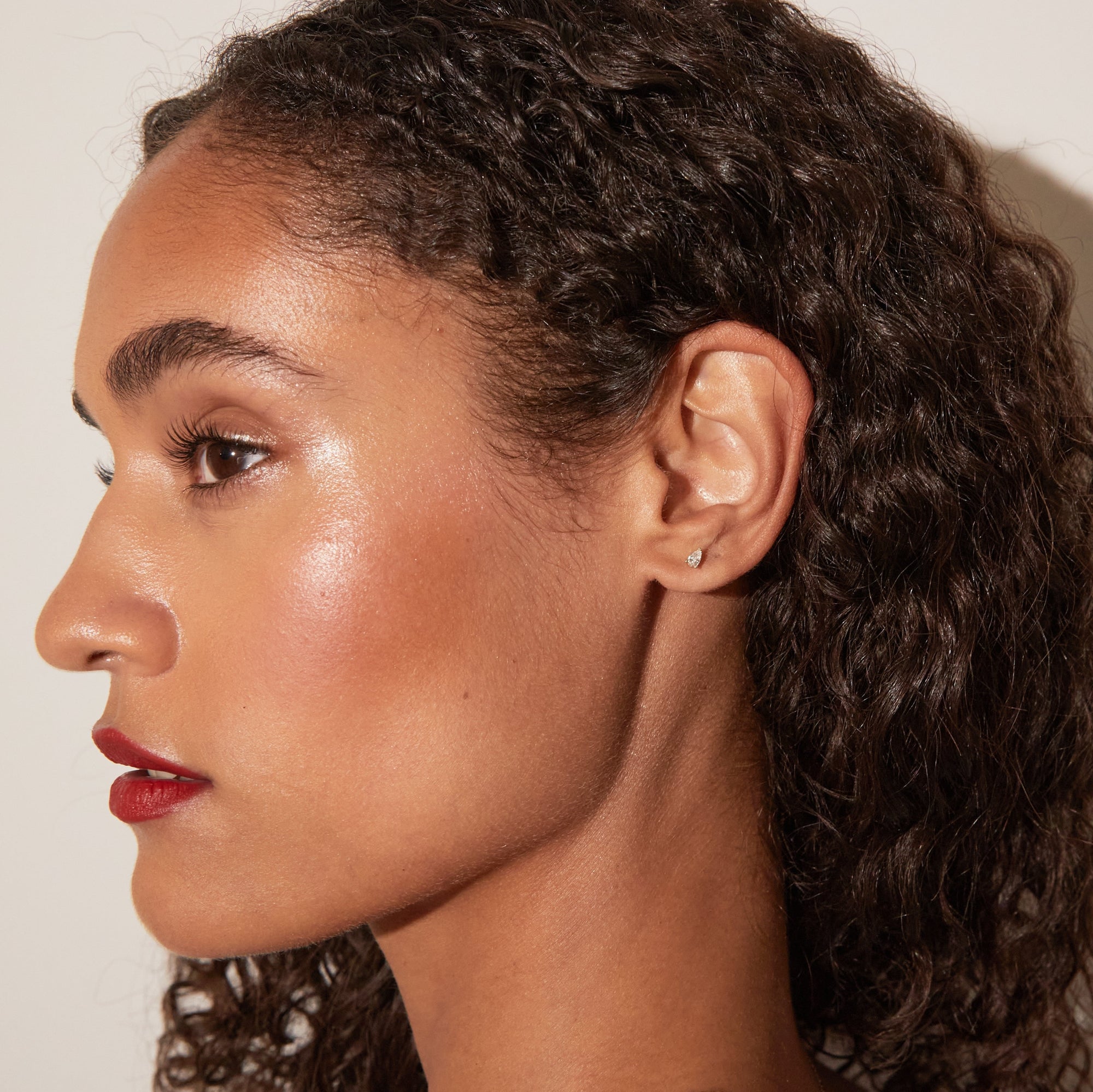 Model. Close-up of a woman's face with a neutral background