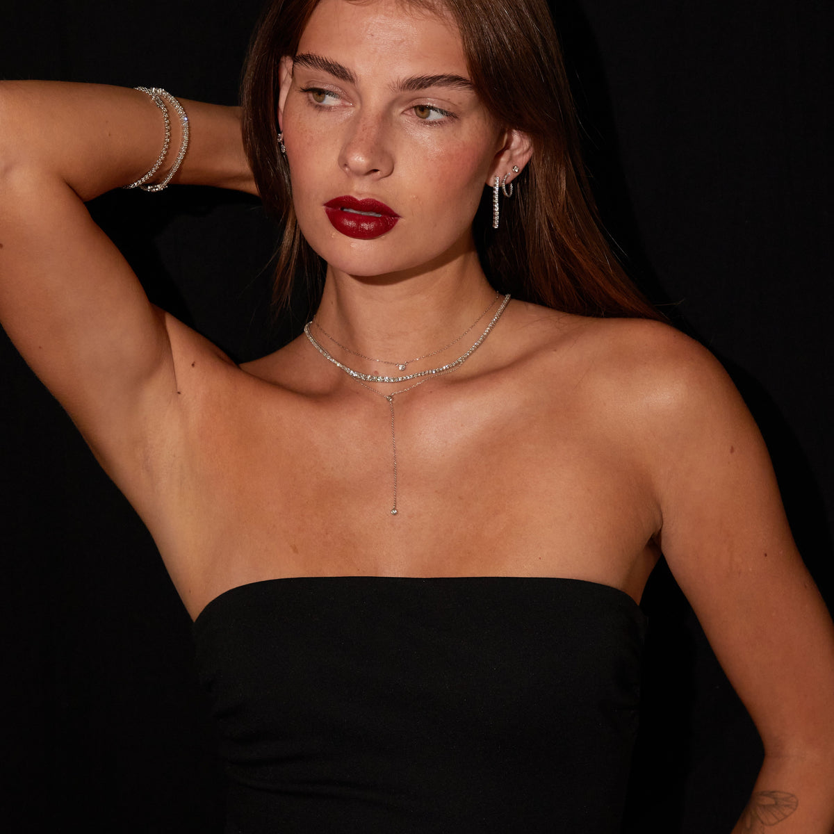 Model. Woman wearing bolo necklace wearing three necklaces 