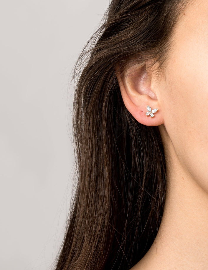 Model Close up of woman wearing a butterfly earring 