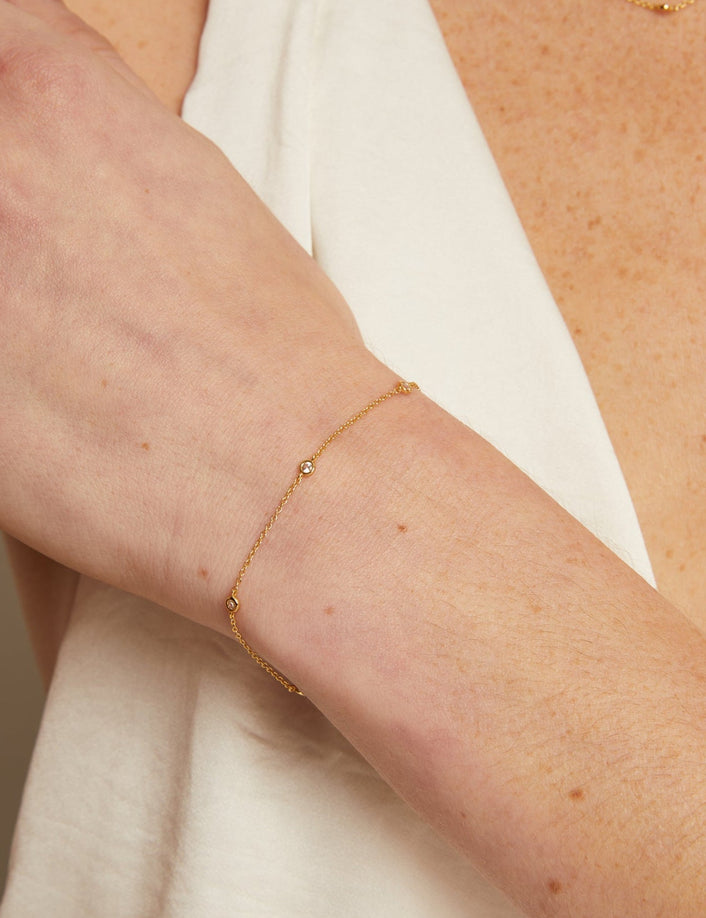 Gold bracelet on a person