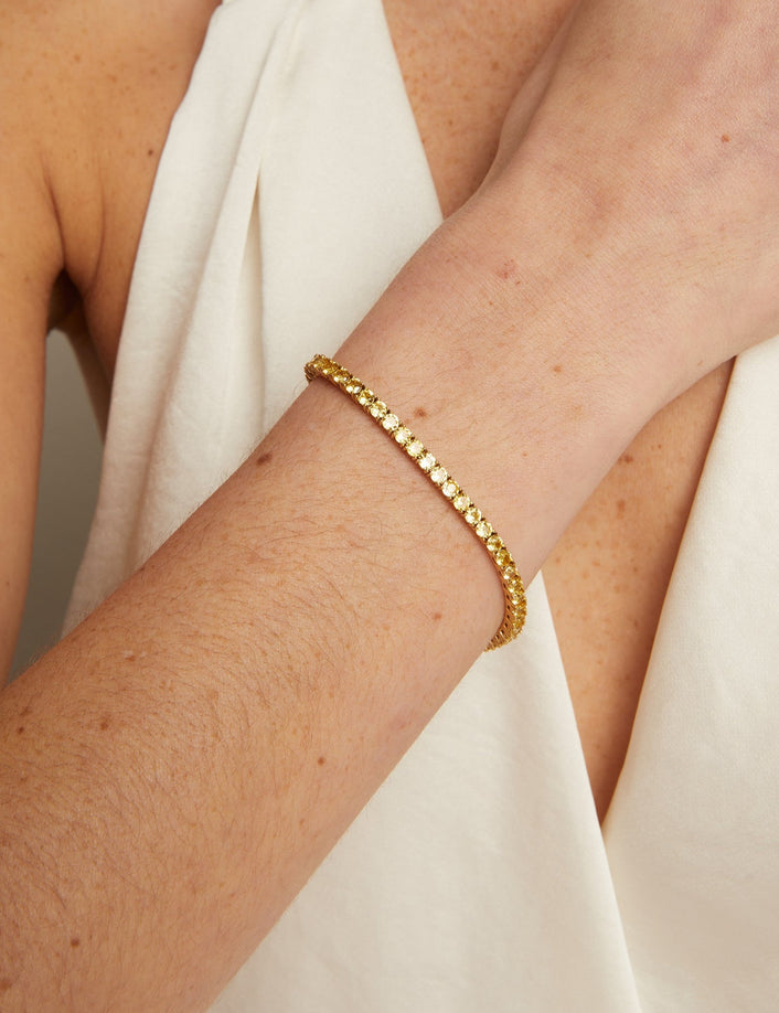 Gold bracelet on a person