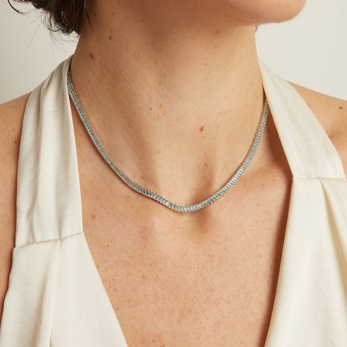 Model. Necklace worn by a person with a neutral background