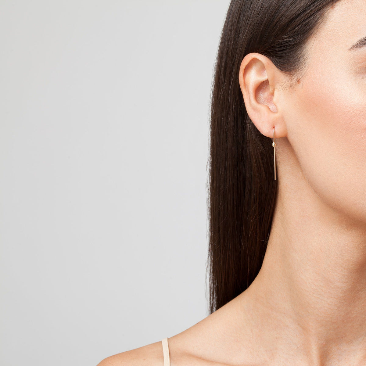Long Gold Ball Hook Earrings On Model