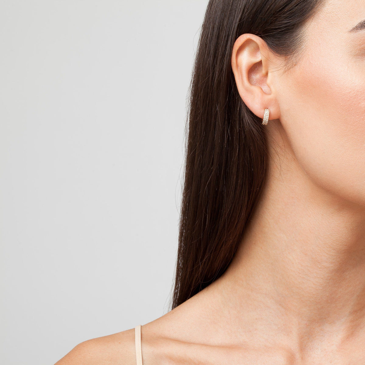 Wide Huggie Earrings with White Diamonds On Model